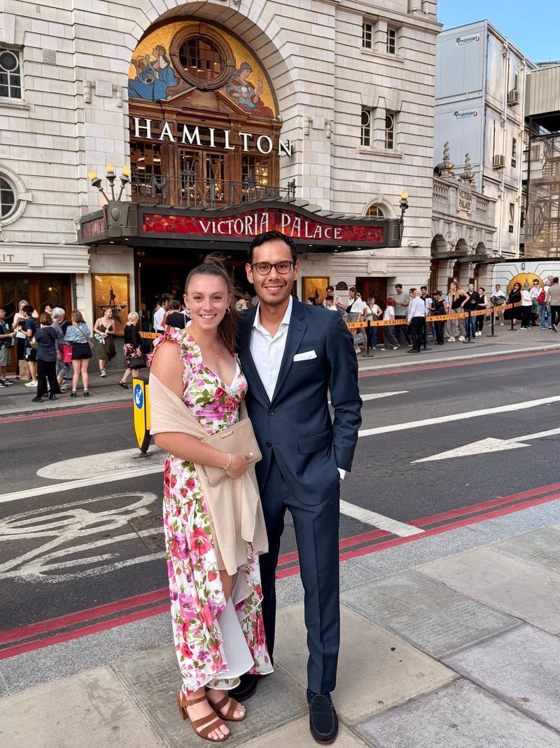 Lucy and Victor outside the theater showing Hamilton